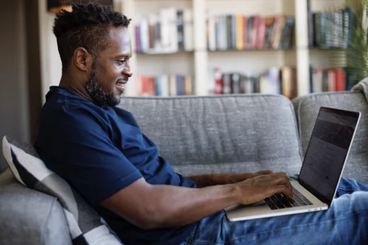Black man with a laptop
