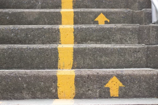 Yellow arrows pointing up the stairs