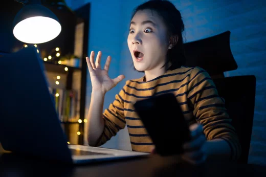 Asian woman shocked deadline and hurry up working overtime at home