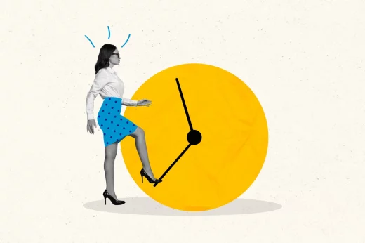 A businesswoman turns the hand of the clock with her foot