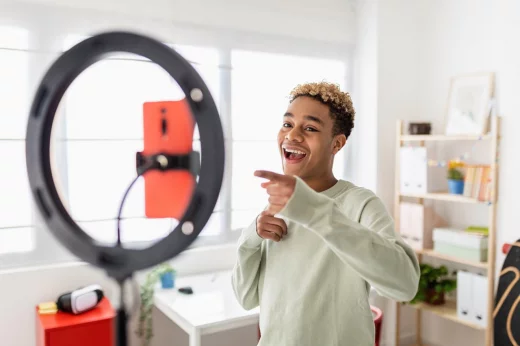 LED ring light. Young man making video