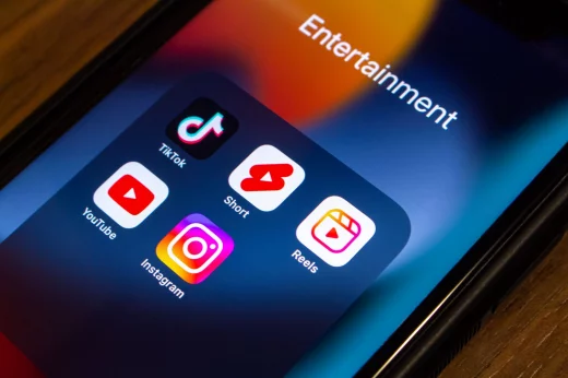 TikTok, YouTube Shorts and Instagram Reels icons on an iPhone